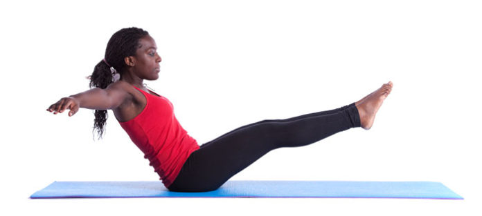 Young-woman-doing-an-ab-exercise Young woman doing an ab exercise