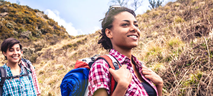 Two students hiking outdoors