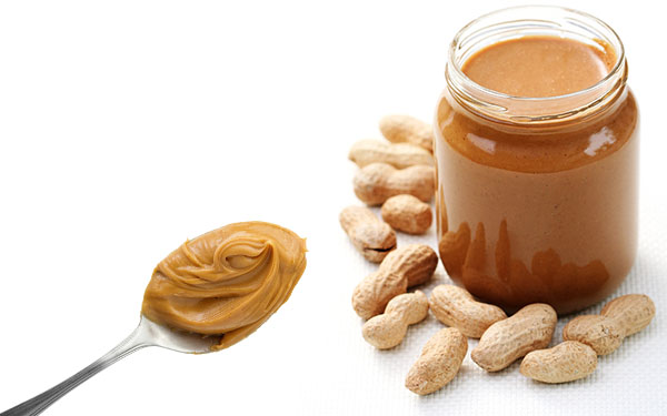 peanut_butter jar of peanut butter and spoon