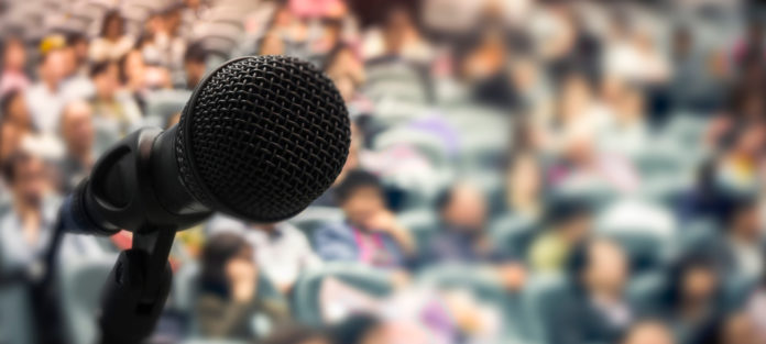 Microphone in front of a crowd