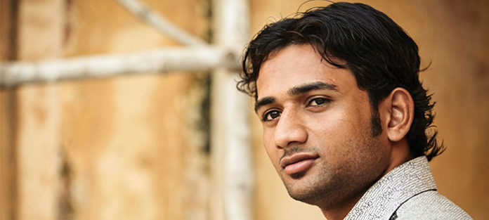 Young man looking to the left with a serious expression