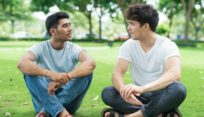 male friends sitting outside talking suicide prevention