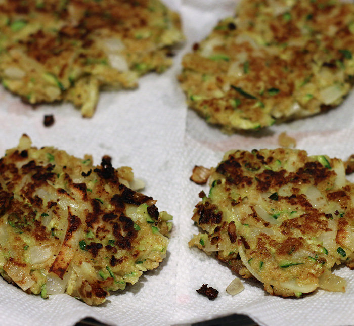 finished latkes cooling on paper towels