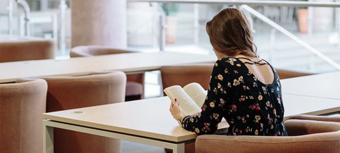 Female-student-reading Female-student-reading