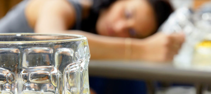 Girl asleep with beer mug