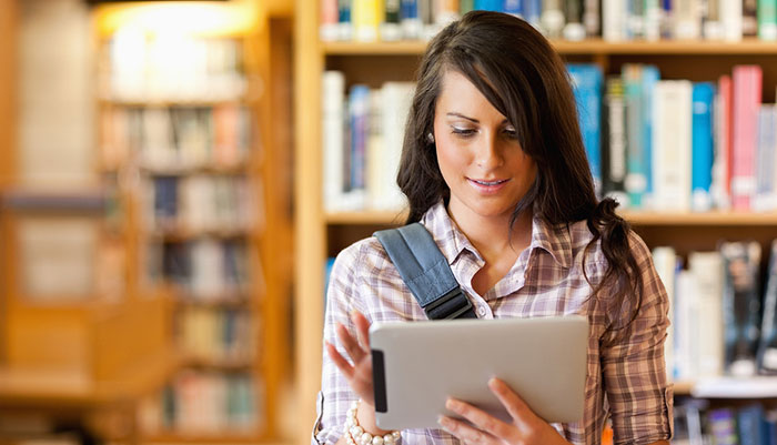 Girl in library with iPad