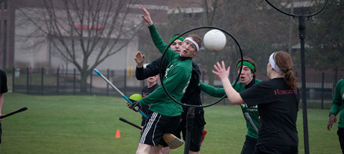 Group-of-college-students-playing-quidditch Group of college students playing quidditch