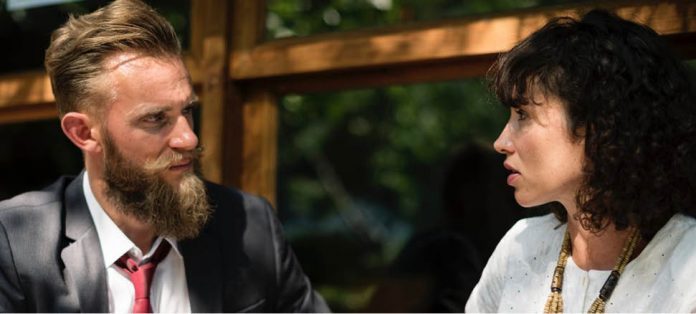 Two adults having a serious conversation