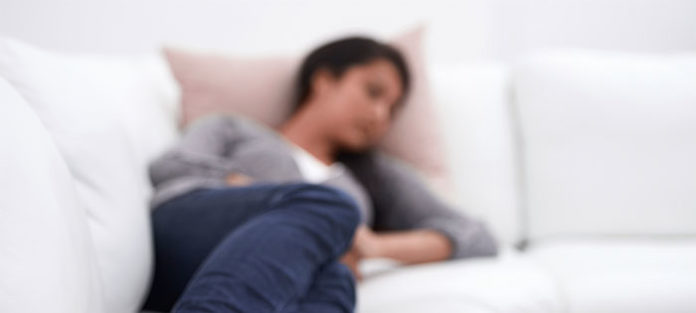 Young-woman-napping-on-the-couch Young-woman-napping-on-the-couch