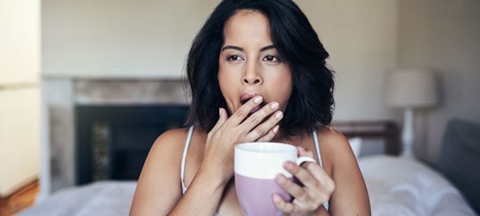 0519_CONWomen_AskDoc_Feature-696x3131 yawning girl holding mug