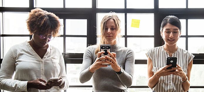 0519_ScreenTime_NT_WOM Three women texting