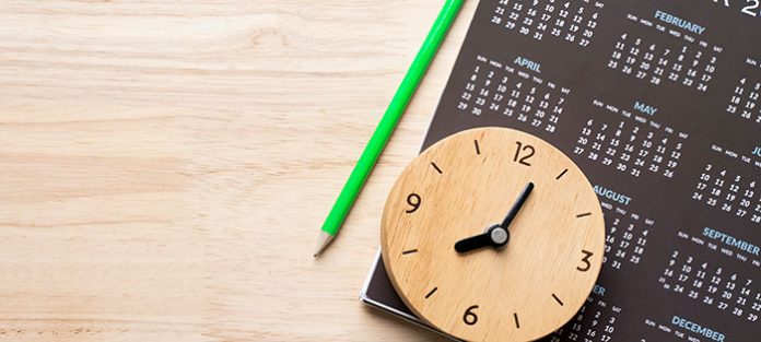Clock on top of a calendar