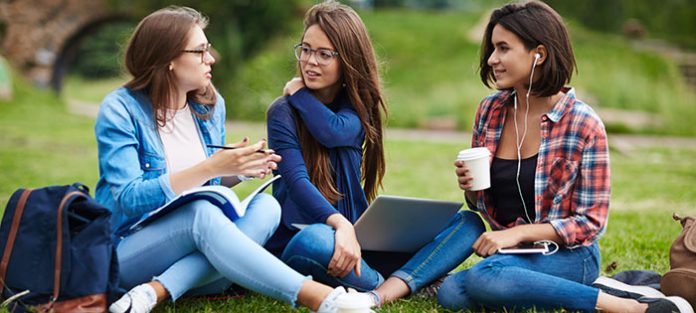 Three girls talking outside