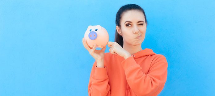 Girl holding piggy bank