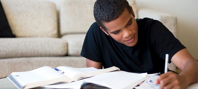 male student practicing his best study method