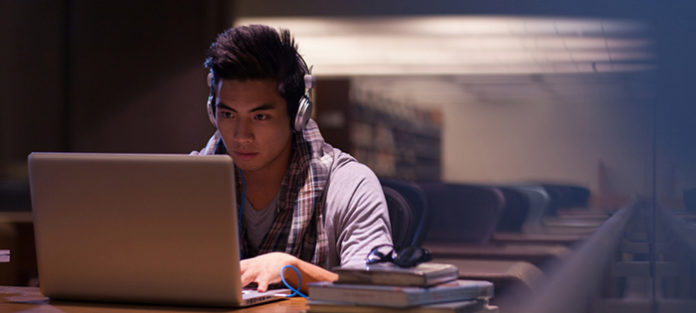 Mixed race male studying