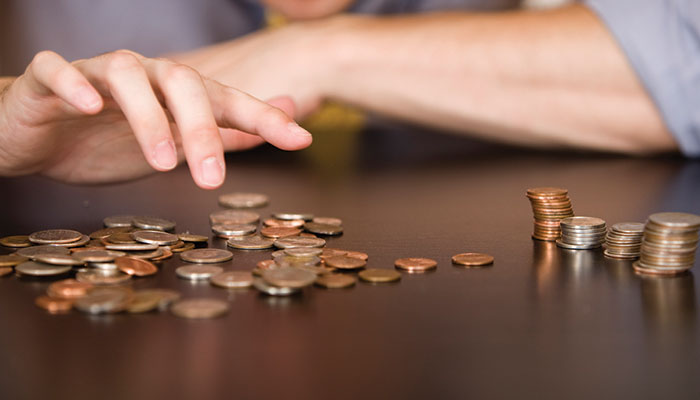 Someone counting coins