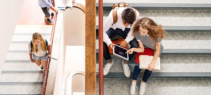 Students studying on a staircase