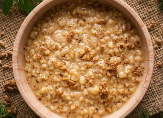 UCookbook: Savory oatmeal with garlicky greens Bowl of savory oatmeal topped with grains and spices on rustic table