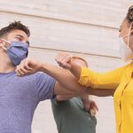 Why social support is the most overlooked self-care routine diverse group of friends greeting each other with an elbow bump and wearing masks | social support mental health
