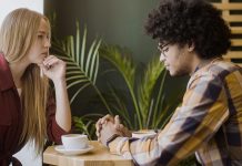 Not all conflict is avoidable—here’s how to navigate fights with your partner interracial couple in an argument at coffee shop | fighting with your partner