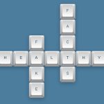 Keyboard keys arranged as crossword spelling healthy facts fake, illustrating evaluating online health information credibility.