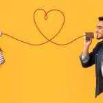 How to communicate wants and boundaries in any intimate moment Two people using string phones forming heart, representing communication and connection.