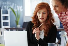 Two women collaborating in workspace | getting a job without an internship