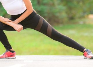 FitnessU: Glute-busting moves to build your backside A woman stretches her legs in a side lunge warm-up on an outdoor path.