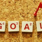 From vision to victory: A student’s guide to setting (and crushing) goals The word “GOAL” spelled with Scrabble tiles, topped with a tiny red flag.