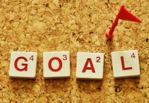From vision to victory: A student’s guide to setting (and crushing) goals The word “GOAL” spelled with Scrabble tiles, topped with a tiny red flag.