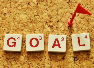 From vision to victory: A student’s guide to setting (and crushing) goals The word “GOAL” spelled with Scrabble tiles, topped with a tiny red flag.