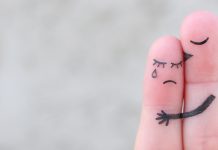 Ask the counselor: How do I know if my partner’s dependency is unhealthy? Two fingers hugging, one sad and one comforting, representing emotional support and dependency