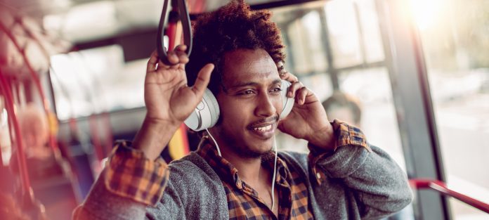 commuter enjoying bus ride with headphones