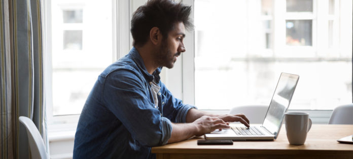 Mixed race male studying