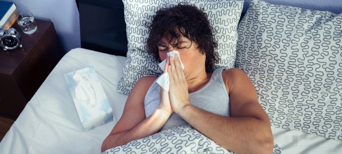 Sick male in bed