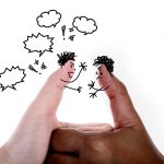 Responding to Microaggressions: When to Speak Up and When to Step Back Cartoon conflict characters drawn on thumbs represent disagreement, tension, or microaggressions.