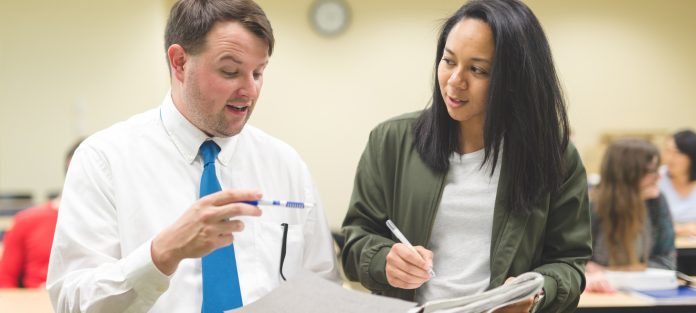 Student talking to teacher