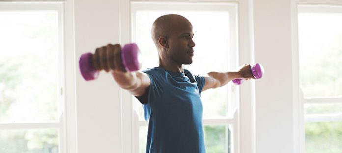 male doing arm workout at home