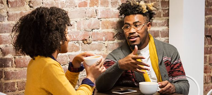 guy and girl talking over coffee