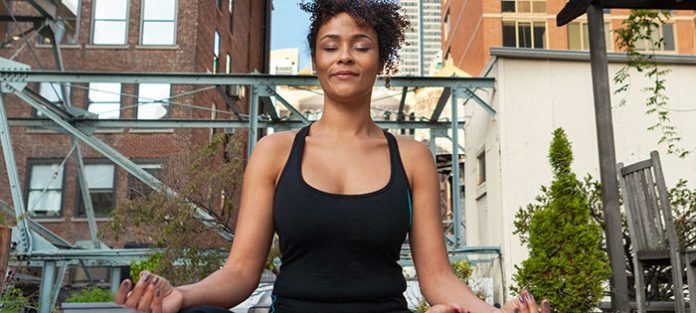Woman meditating outside