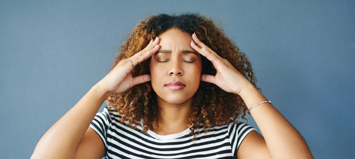 black young woman trying to focus
