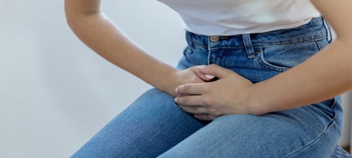 girl holding her stomach