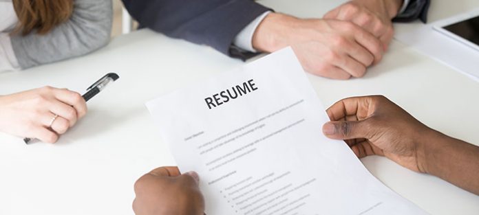 someone holding a resume