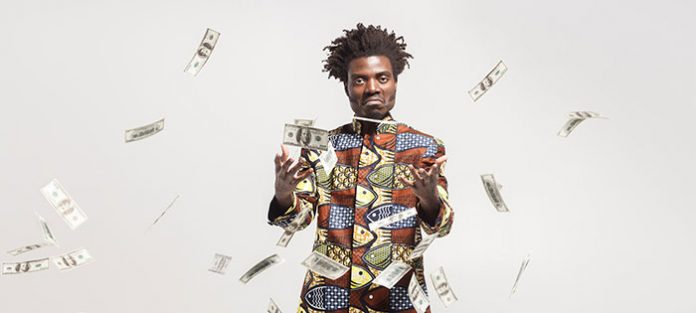 Guy throwing money in air