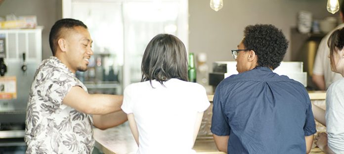Students sitting at a counter