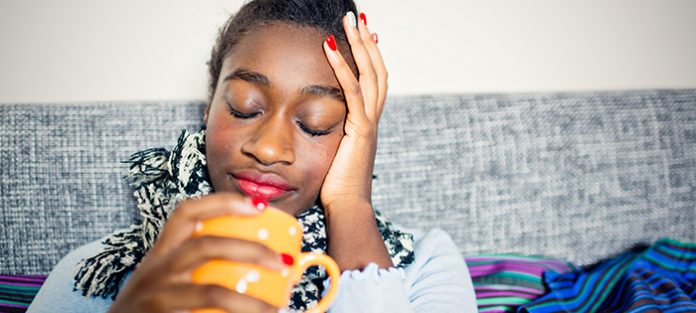 Girl drinking out of a mug